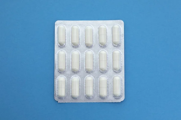 Capsules Package Blue Background — Stock Photo, Image