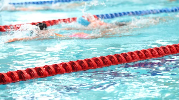 Dividing the red buoy in the pool with clean water