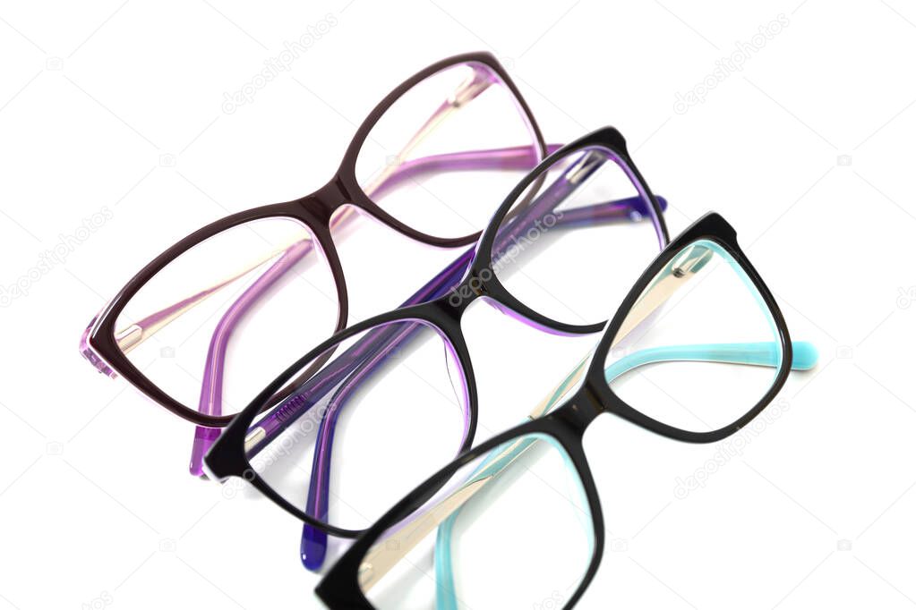 Three pairs of plastic fashionable eyeglass frames. Isolated
