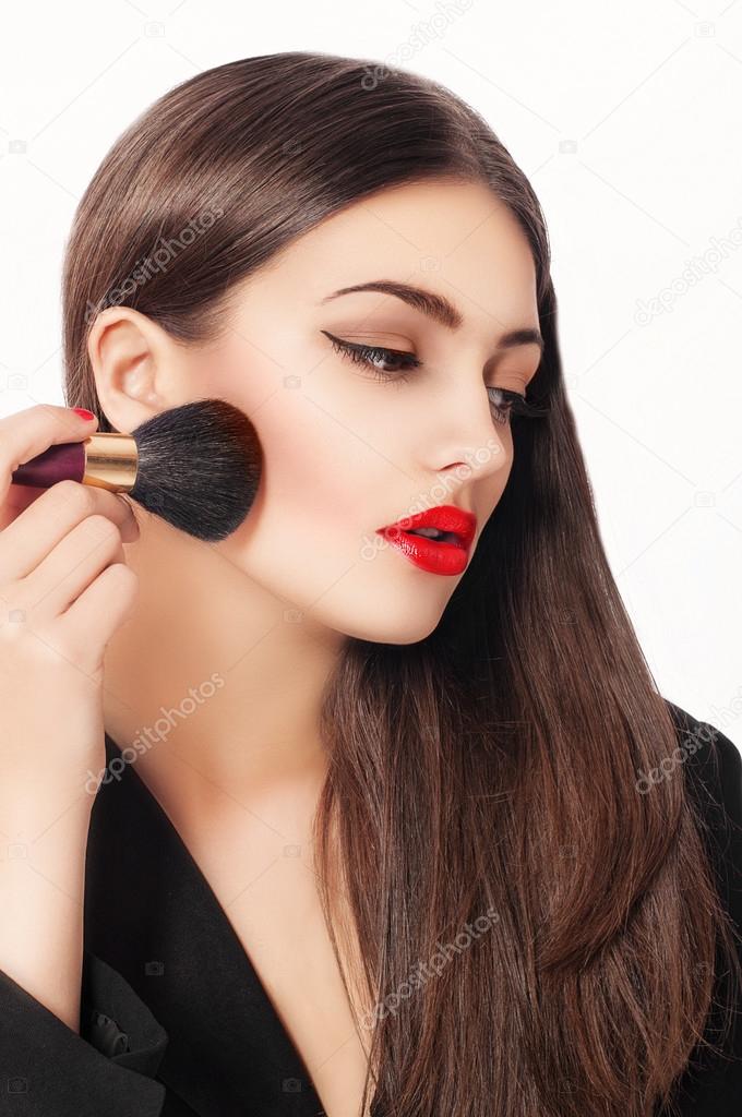 Makeup. Beauty Girl with Make up Brushes. Natural Make-up for Brunette Woman with Brown Eyes. Beautiful Face. Makeover