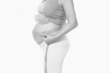 Gebelik. Hamile kadının karnında. Ölçüm hamile karnına santimetre. Sağlık. Tıp