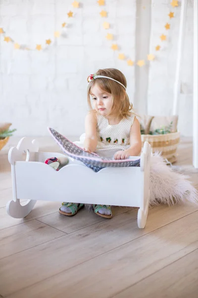 Little Cute Girl White Dress Plays Doll Bed Bright Children — Stock Photo, Image