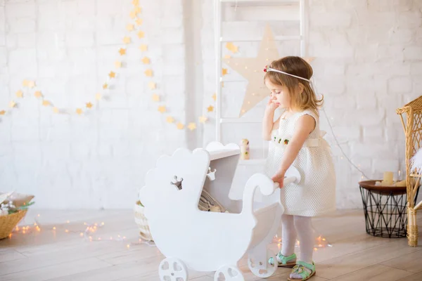 Little Cute Girl White Dress Plays White Peg Dolls Bright — Stock Photo, Image