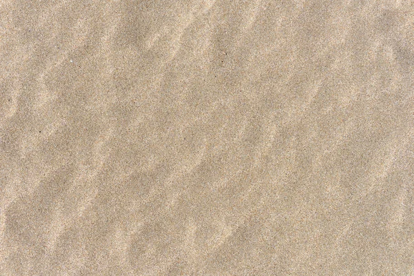 A homok a tengerparton, homokos strand háttér közelről — Stock Fotó