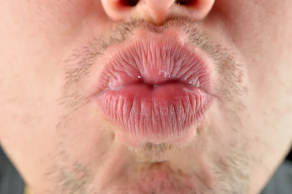 Man lips sending a kiss. Concept photo of male sexuality