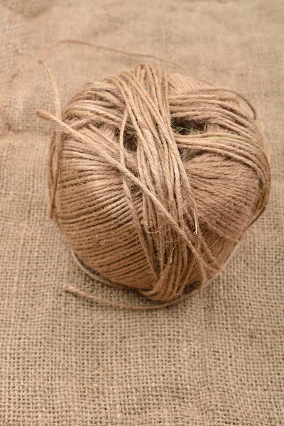 Close up of hank of twine, reel of rope, ball of hemp thread on — Stock Photo, Image