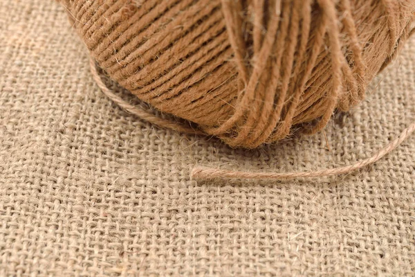 Close up of hank of twine, reel of rope, ball of hemp thread on — Stock Photo, Image