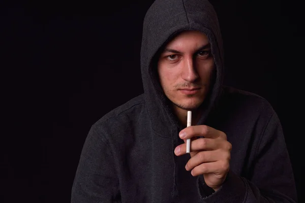 Isolated smiling rebellious teenager in a hooded sweatshirt smok — Stock Photo, Image