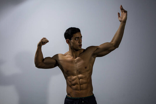 Fitness Model Displaying Upper Body Physique