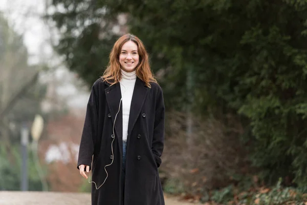 Young Woman Wearing Long Black Wool Coat Smiling Camera Public — Stock Photo, Image