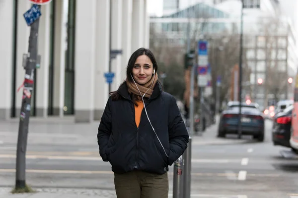 Portrait Young Indian Woman Posing City Street Hands Pockets Listening — Stock Photo, Image