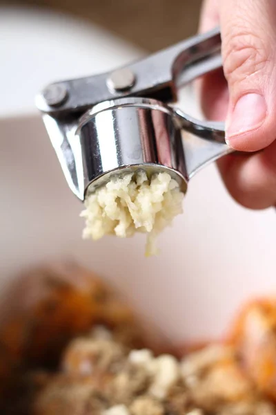 Garlic crushed using a garlic press