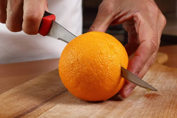 Cutting Orange Half — Stock Photo, Image