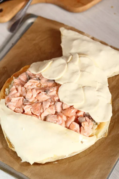 Arrange puff pastry rounds on top of filling. Making Salmon in Puff Pastry Series.