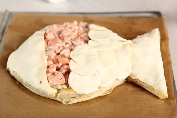 Arrange puff pastry rounds on top of filling. Making Salmon in Puff Pastry Series.