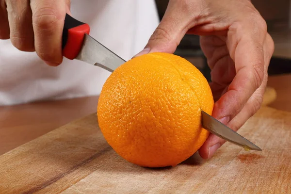 Cutting Orange Half — Stock Photo, Image