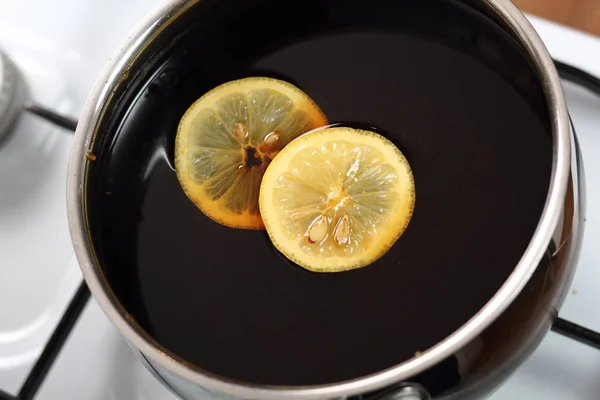 Lemon slices in black treacle syrup