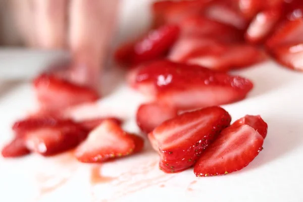 Slicing strawberry. Making frozen strawberry cheesecake series.