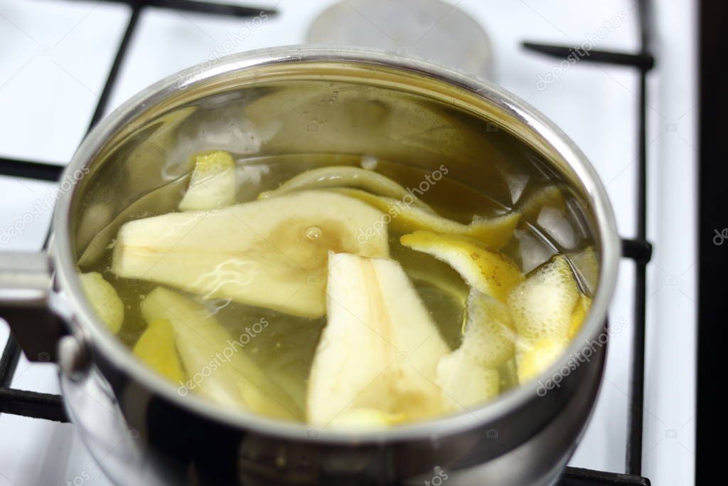Boiling pear halves with lemon peels. Making Chocolate, Pear and Pecan Pie Series.