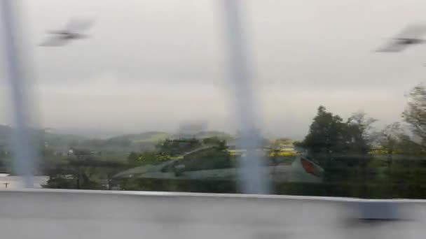 Countryside view through car window. Car riding on highway. Green landscape from car. Reflection of car in chipper — Stock Video