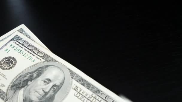 Man counting money. Dollars in hand. Male hands count dollar bills. Close up of one hundred dollar paper money pile on office desk. Concept of finance and money payment — Stock Video