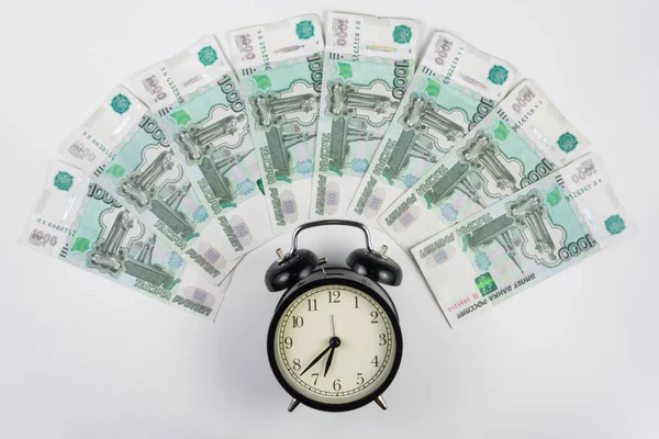 Around alarm fan lined thousandths ruble bills — Stock Photo, Image