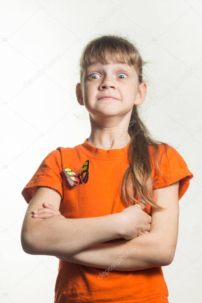A lapel portrait of a gay little girl with funny eyes bulging