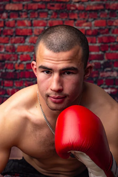 Portrait of a boxer against a brick wall — Stock Photo, Image