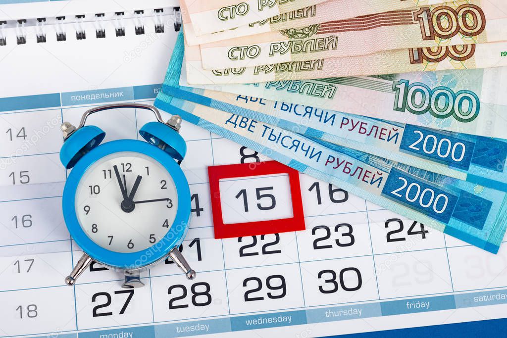 The calendar marks the fifteenth, with banknotes and watches lying next to