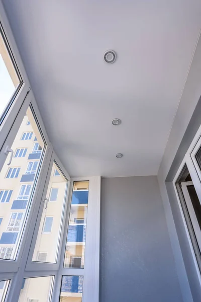 Stretch ceiling in the interior of a small balcony