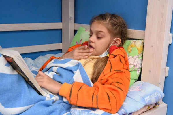 Sick Girl Sneezes Lying Bed Reading Book — Stock Photo, Image