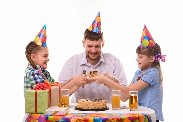 Children fight for the first piece of birthday cake