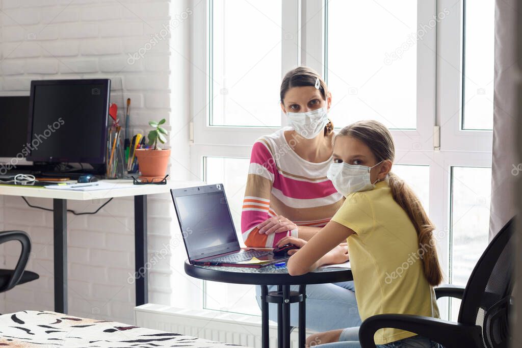 Mom and quarantined daughter study in self-isolation mode without leaving home