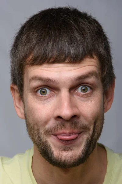 Portrait Cheerful Man European Appearance Showing Tongue Close — Stock Photo, Image