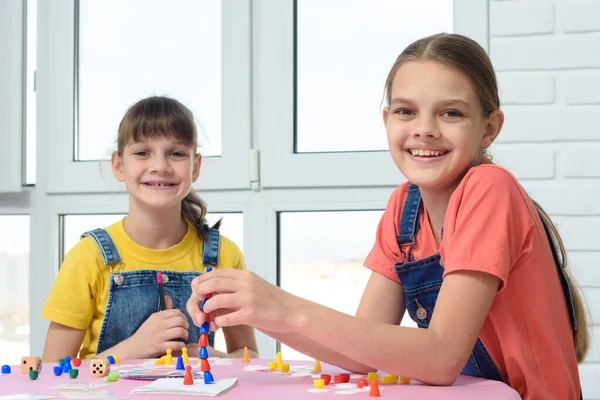 Two Happy Girls Play Board Game Looked Frame — Stock Photo, Image