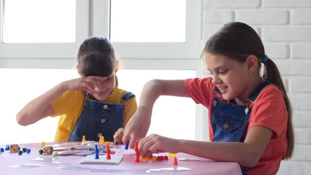 Two Girls Play Board Games Joyfully Cheerfully — Stock Video