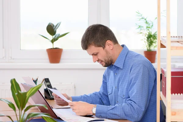 Office Specialist Reads Bad Investment a Report