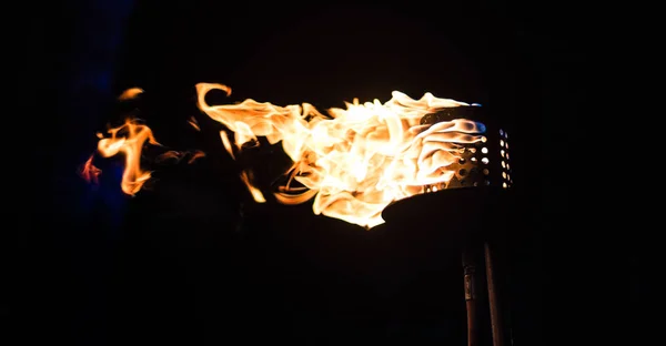 Burning Torch in the Night at black background — Stock Photo, Image