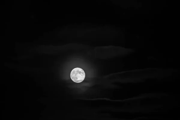 Moon between the clouds in black and white full moon halloween monthly cycle astrology — Stock Photo, Image