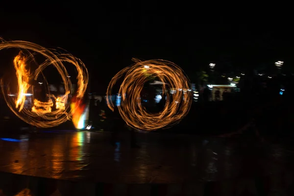 Fire Show Flaming Trails on stage slow shutter exciting event concept space for text — Stock fotografie