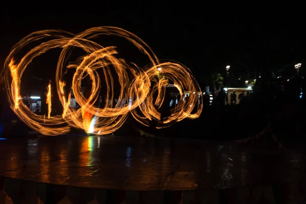 Fire Show Flaming Trails on stage slow shutter exciting event concept space for text — Stock fotografie