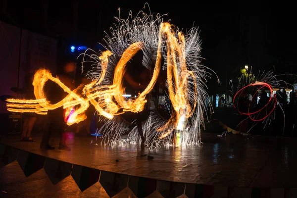 Fire Show Flaming Trails on stage slow shutter exciting event concept space for text — Stock fotografie