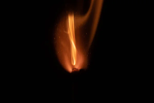 Ignition of match with sparks isolated on black background space for text fire concept passion figures variety — Stock Photo, Image