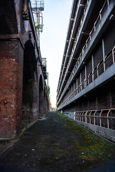 Deserted lane way parking garage urban walkway big city geometric linear