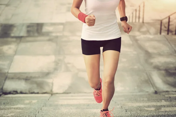 Sport woman running upstairs — Stock Photo, Image