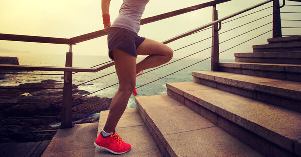 young sport woman running upstairs