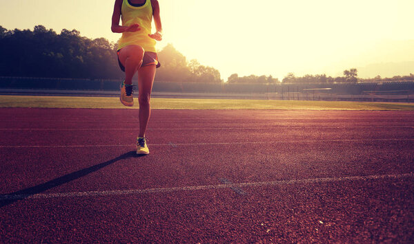Young woman stretching legs 