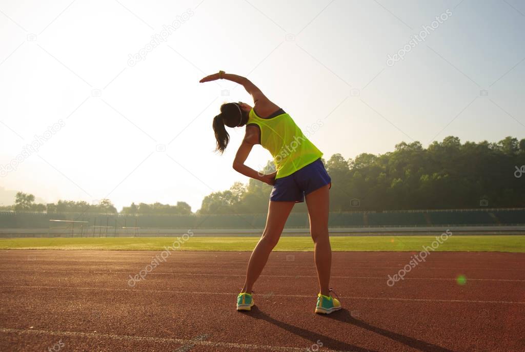 Young woman stretching 