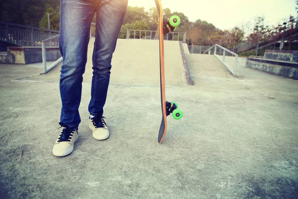 Skateboarder legs riding skateboard — Stock Photo, Image