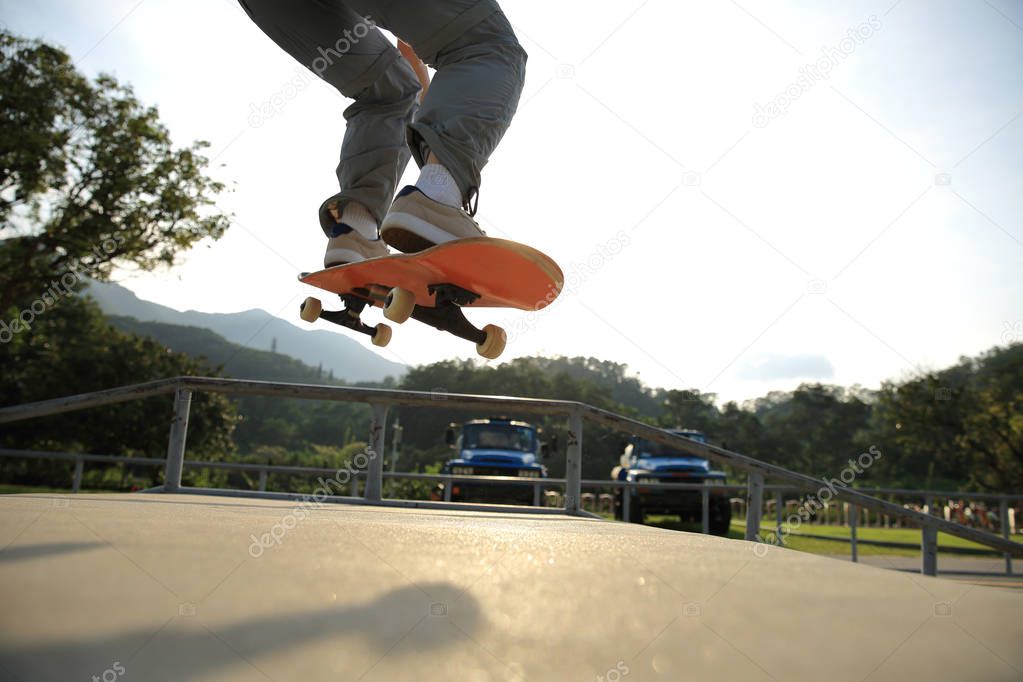 skateboarder practicing at skatepark